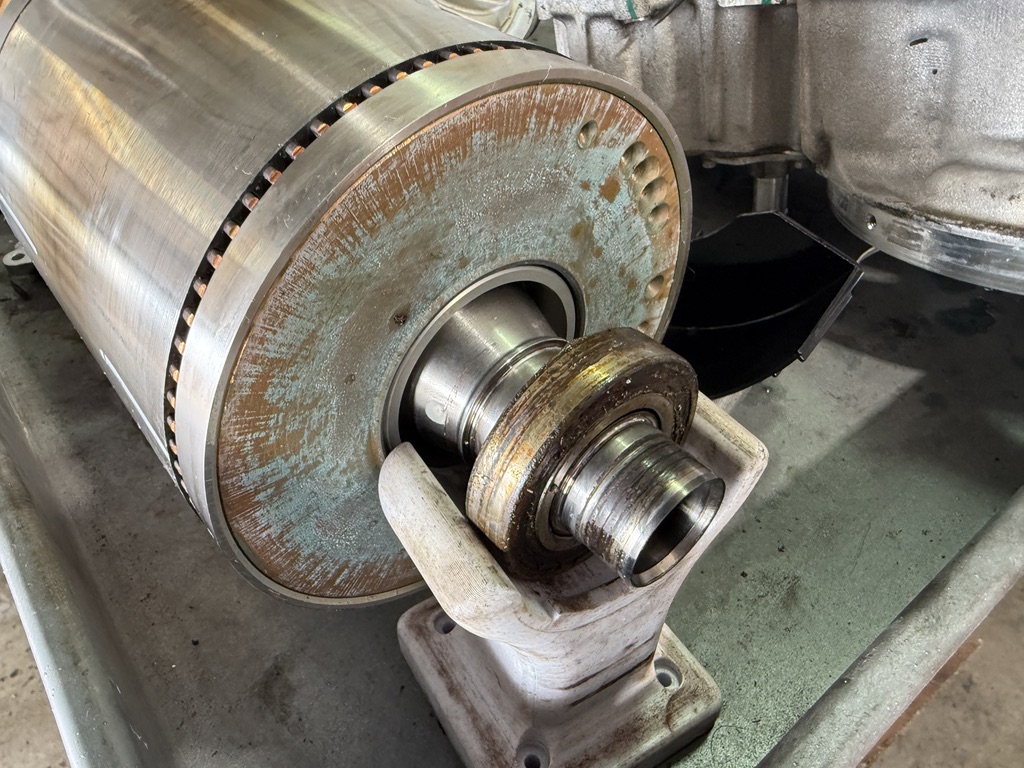 Failed Tesla drive unit showing catastrophic coolant damage - Tesla Heroes repair in Plano prevents this